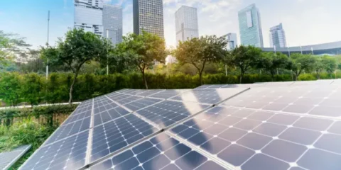 5f8d7441e87fe solar panel plant with urban landscape landmarksecological energy renewable concept.webp 665x350